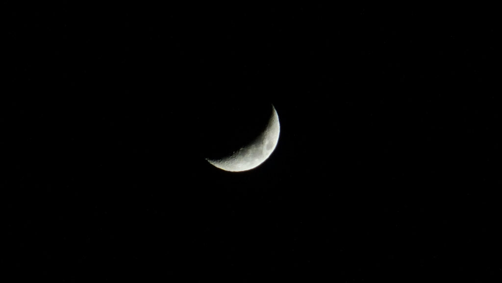 Serene Crescent Moon Wallpaper: Tranquil Black Sky Background