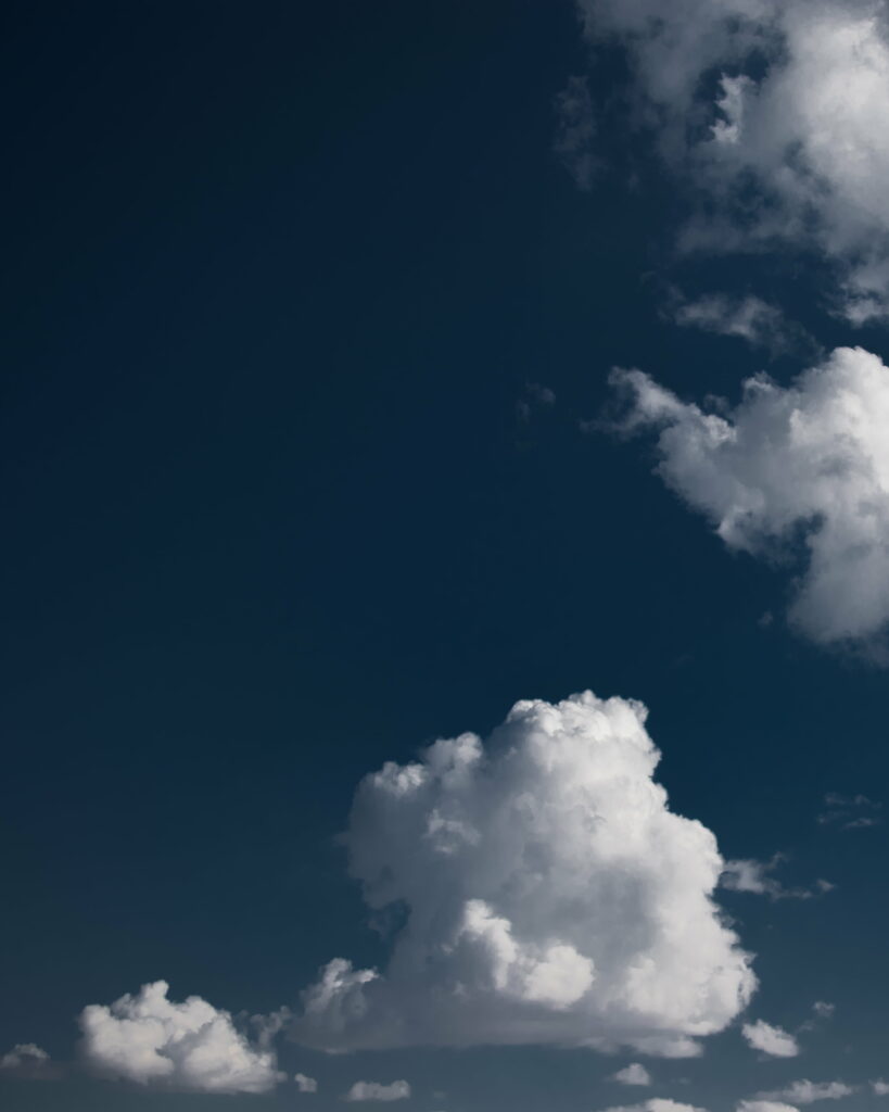Serene Daytime Sky HD Wallpaper: Fluffy Clouds & Blue Background