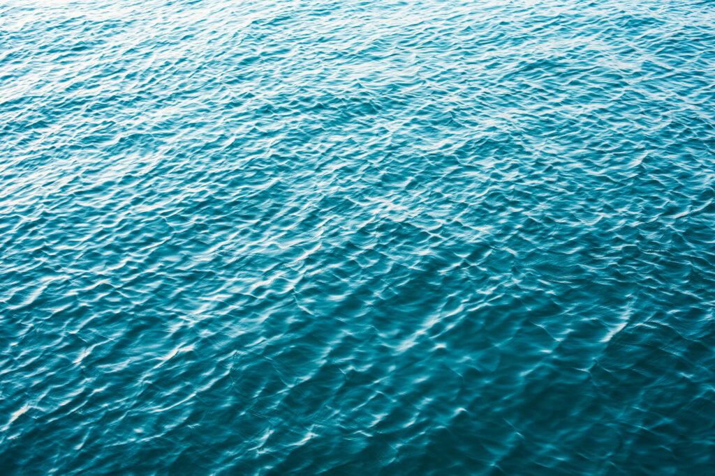 Serenity's Abyss: Tranquil Waters in Minimalistic Blue HD Wallpaper