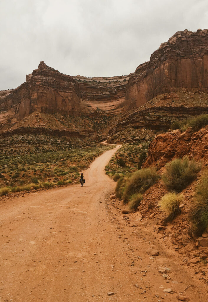 Serene Desert Landscape Wallpaper with Winding Road & Rocky Cliffs