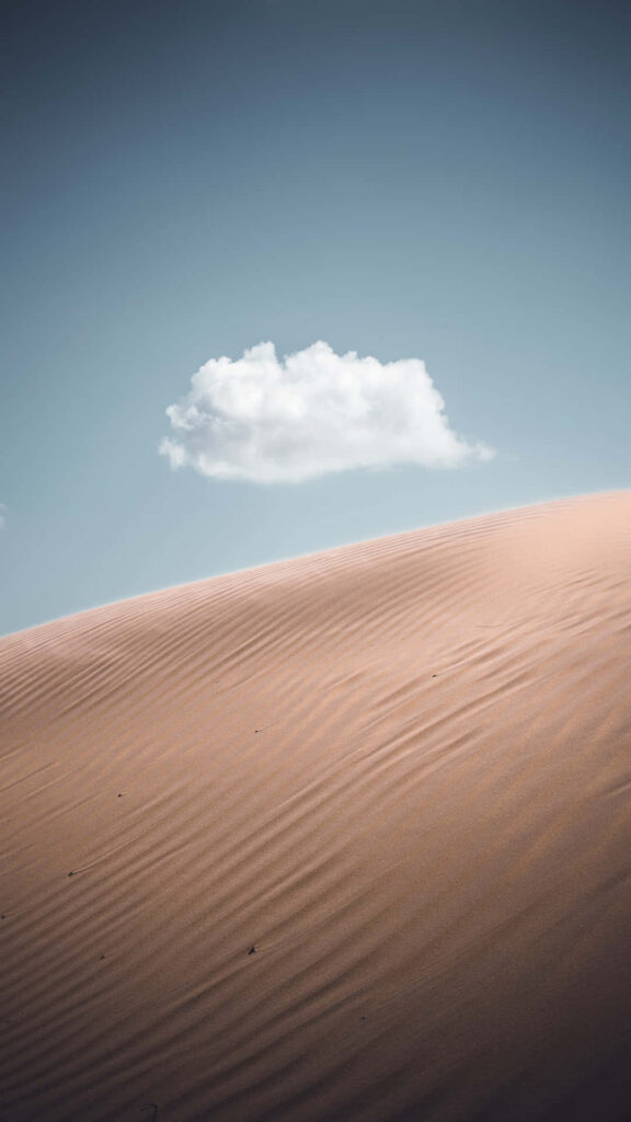 Serene Desert iPhone Wallpaper: Minimalist Dunes & Tranquil Sky