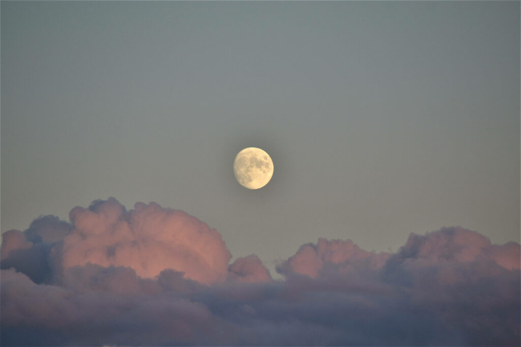 Glowing Full Moon Wallpaper: Serene Clouds in a Peaceful Sky