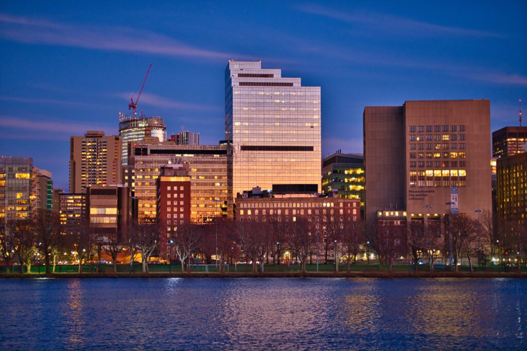 Serene Cityscape Wallpaper: Dusk Glow & Riverside Reflections
