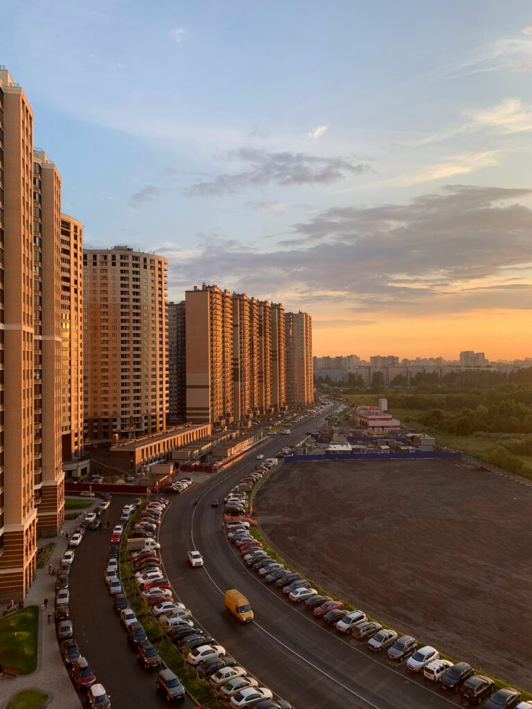 Serene Urban Sunset Wallpaper: Golden Skies & Tall Buildings