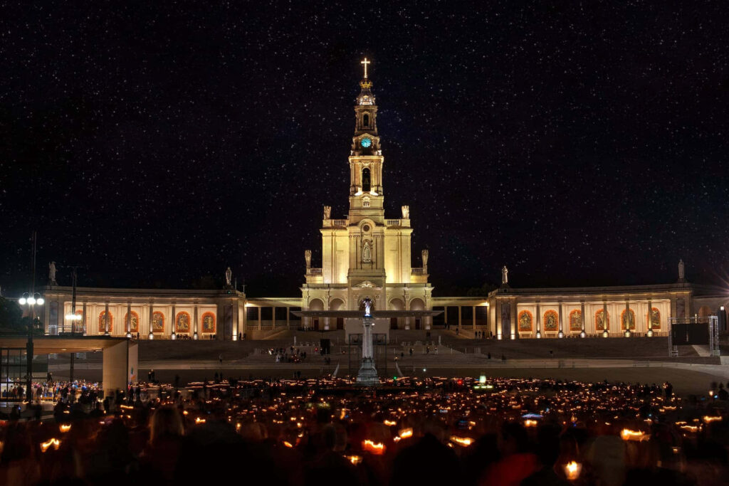 Serene Night at Fatima Sanctuary: Illuminated Architecture & Candlelight Wallpaper