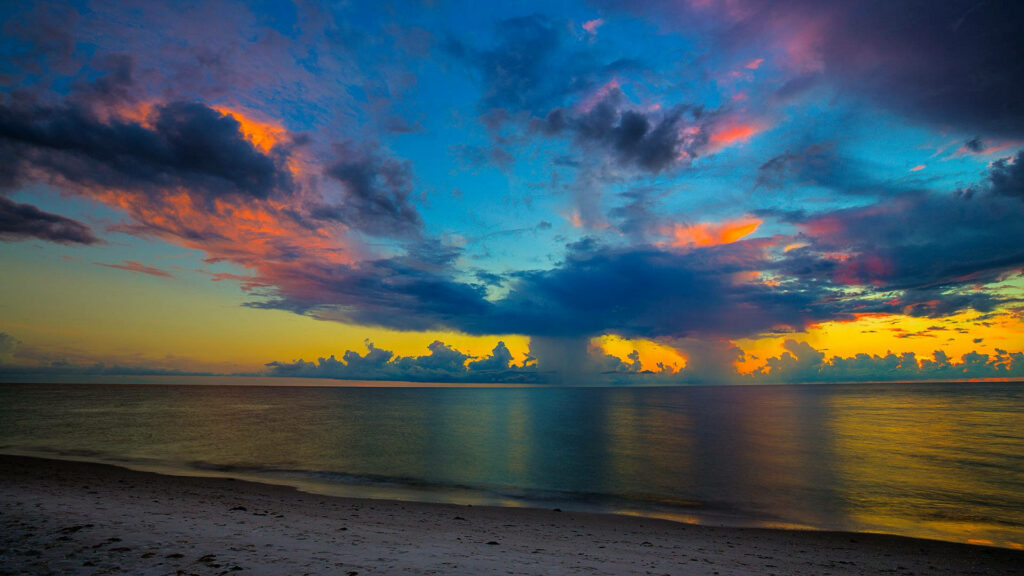 Vibrant Sunset Beach Wallpaper: Tranquil Florida Scene with Colorful Clouds