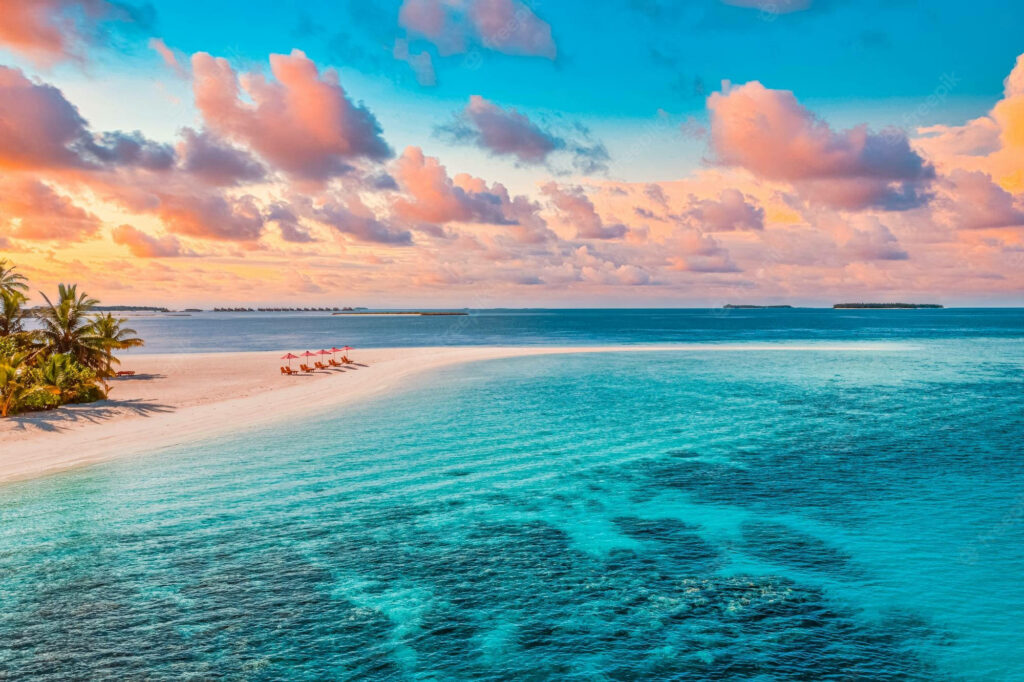 Florida's Enchanting Coastal Haven: A Mesmerizing Seascape with Radiant Orange Clouds Wallpaper