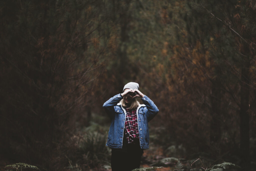 Heart in Nature: Serene Forest Wallpaper with Hands in Love