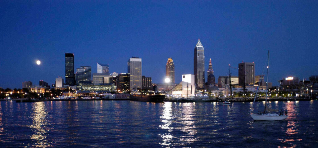 Moonlit Ohio Cityscape: Tranquil Waters & Modern Architecture Wallpaper