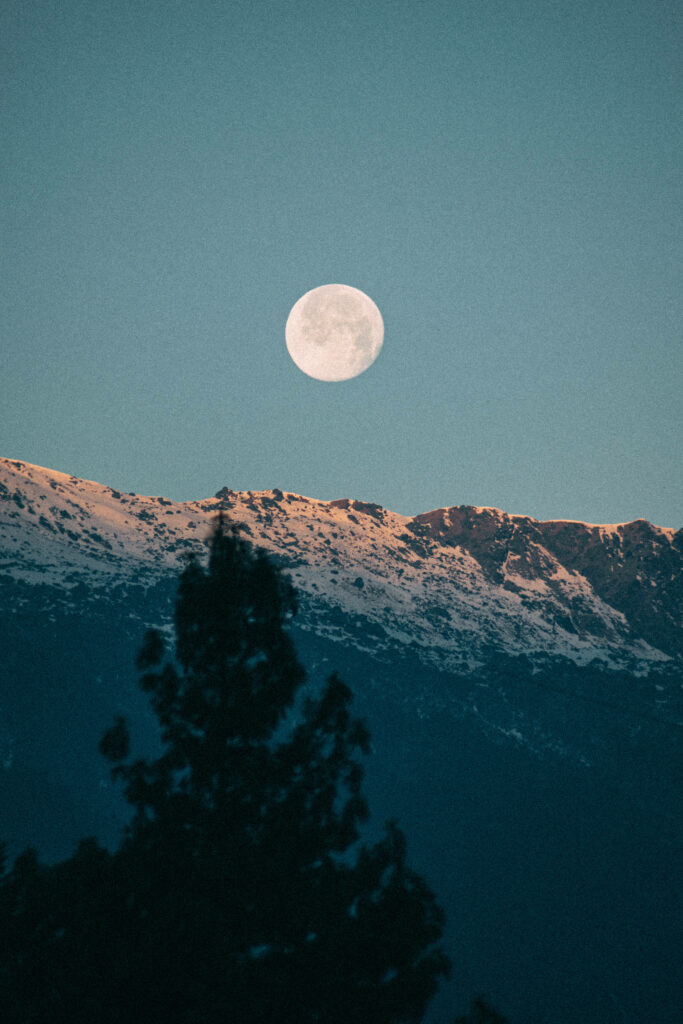Serene Full Moon Wallpaper: Illuminated Snow-Capped Mountains & Trees