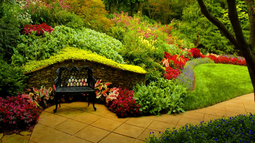 Relaxing in Nature: HD Wallpaper of Lush Garden with Plants and Comfy Chair