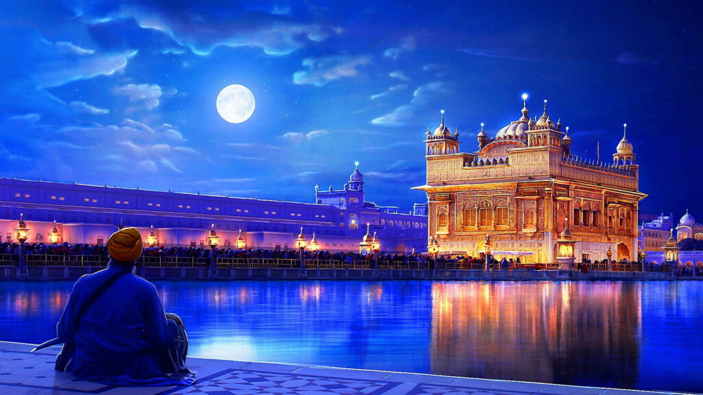 Serene Night View of Golden Temple, Punjab - Illuminated Wallpaper