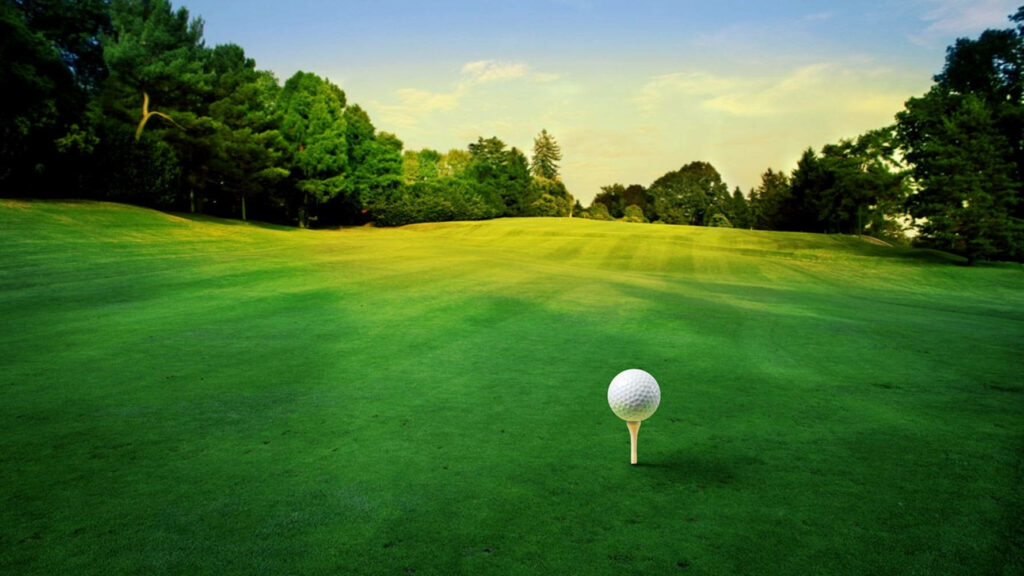 Serene Golf Course Wallpaper: Manicured Green, Ball on Tee