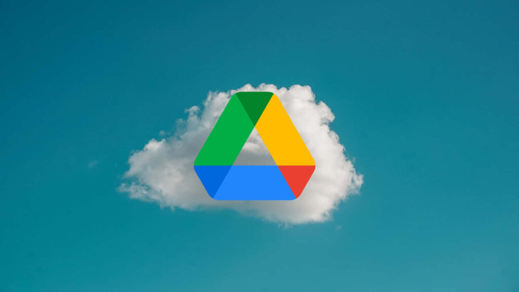 Google Drive Logo Wallpaper: Serene Blue Sky & Fluffy Cloud Background