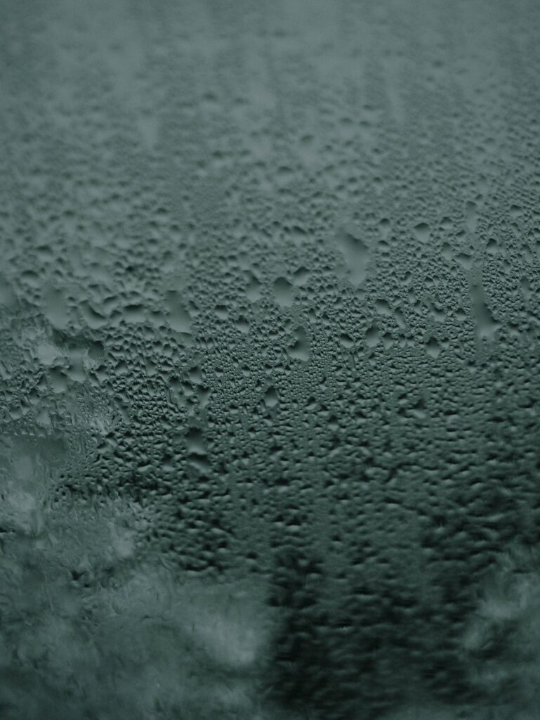 Serene Gray Glass Surface with Water Droplets - Macro Wallpaper Background