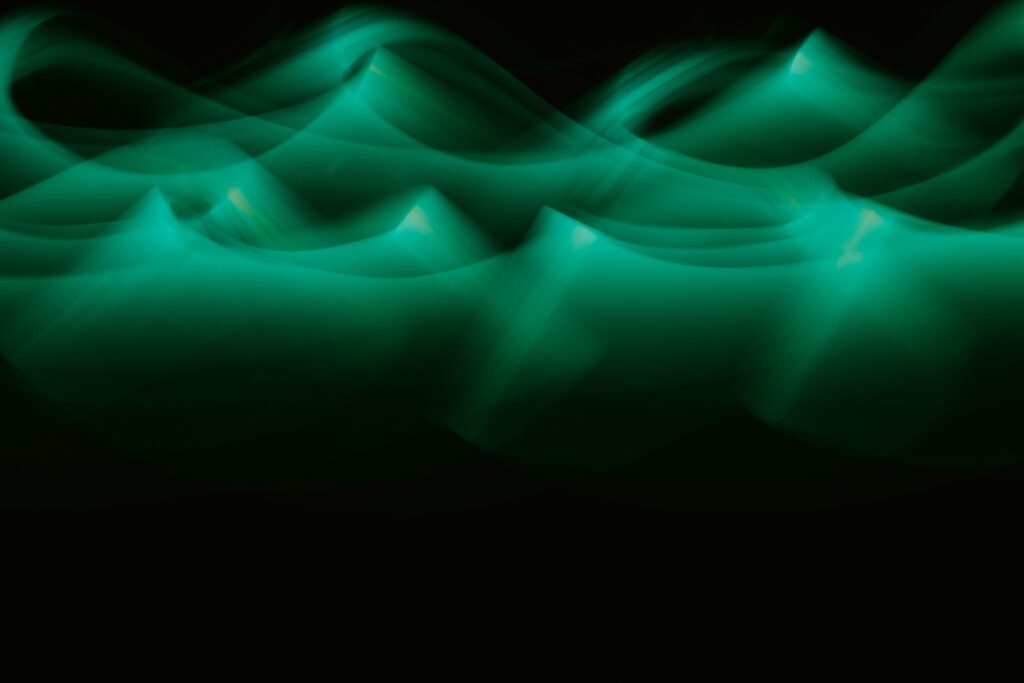 Abstract Green Wave Wallpaper: Smooth, Serene Background Design