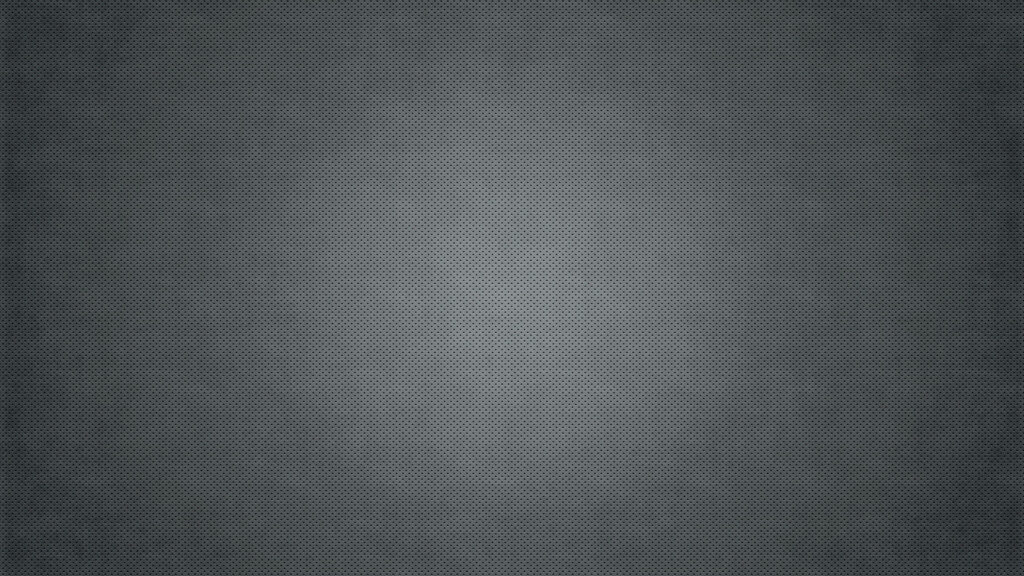 A Subtly Textured Grey Background Enhancing the Center's Soft Radiance Wallpaper