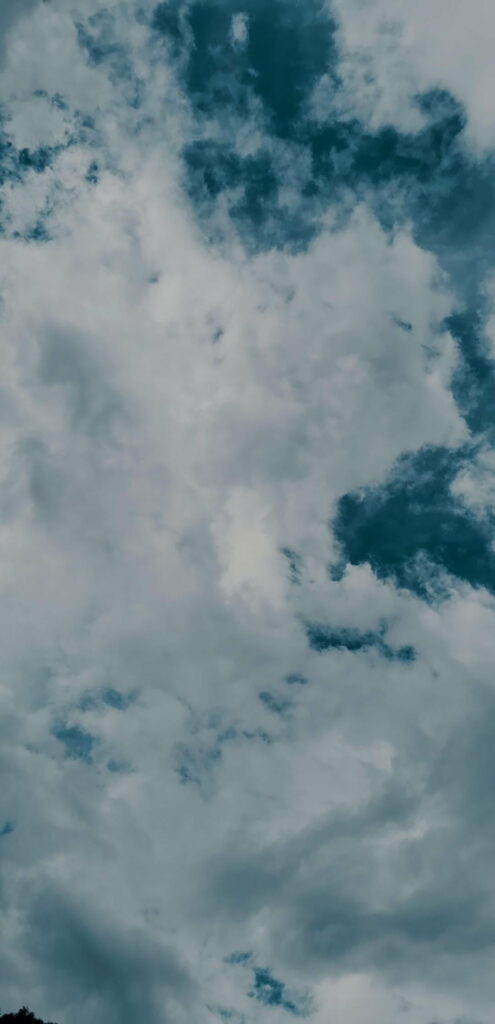 HD Cloudy Sky Wallpaper: Serene White & Gray Clouds on Blue Background