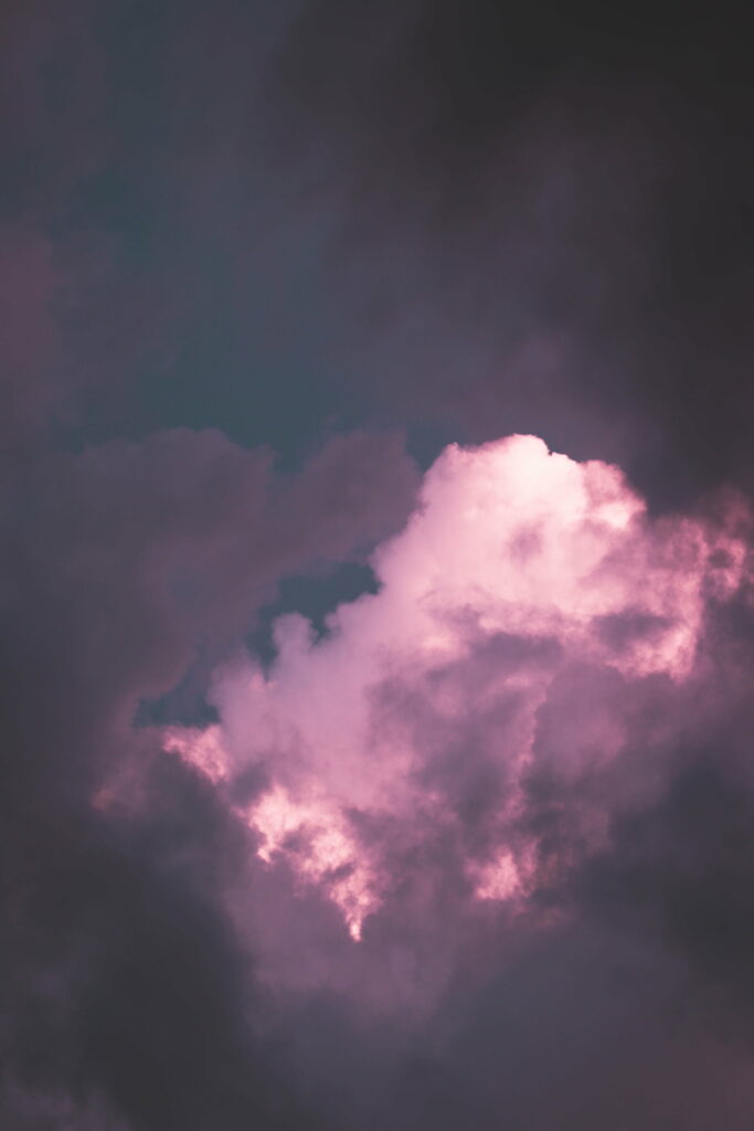 Serene Purple Sky HD Wallpaper: Dramatic Clouds & Glowing Light