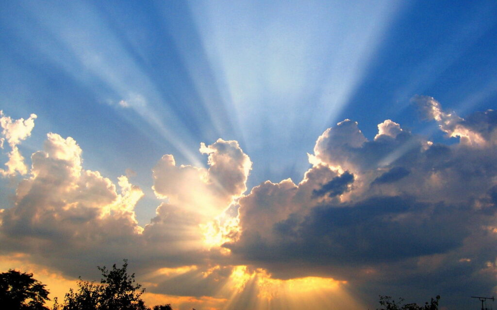 Stunning HD Wallpaper: Sun Rays Piercing Clouds - Dramatic Sky Background