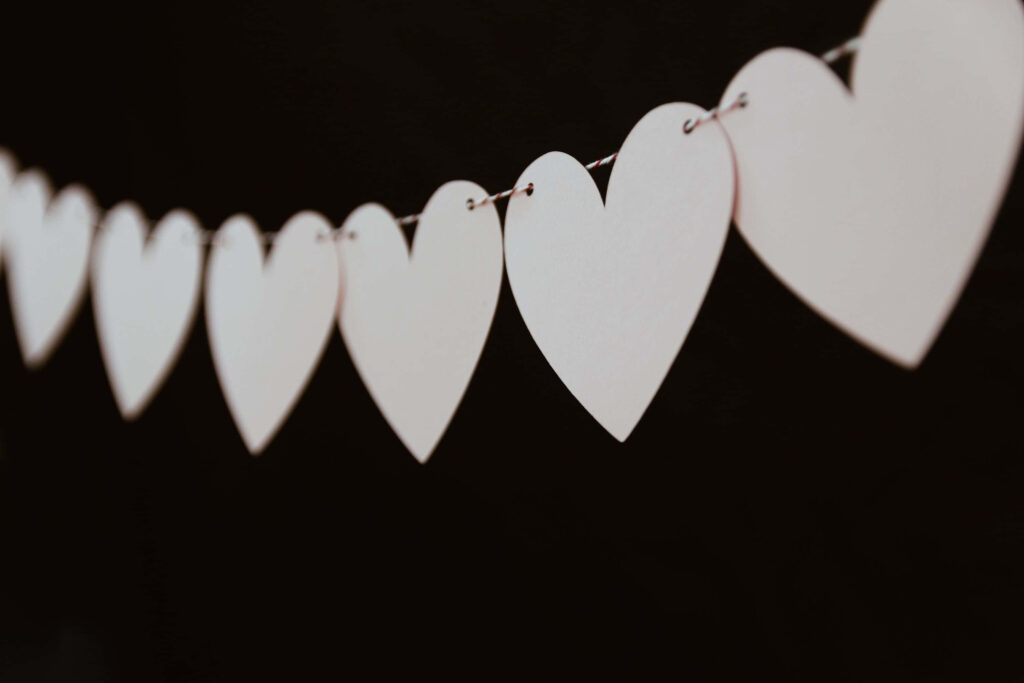 Serene Heart-Shaped Cutouts Wallpaper: Love & Compassion Background