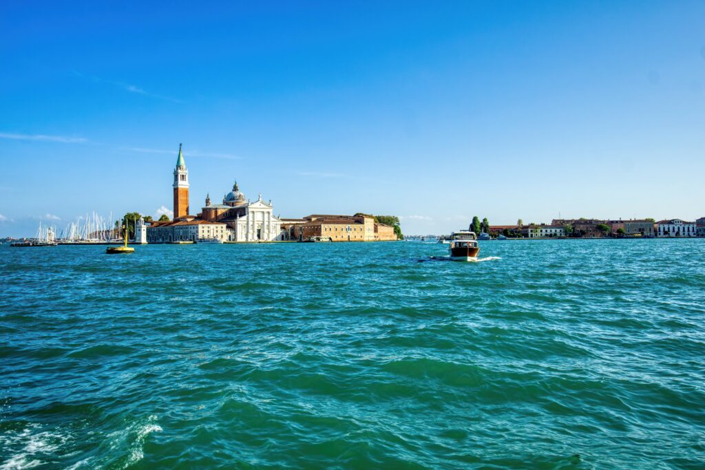 Serene Cityscape Wallpaper: Charming Historic Scene by the Sea
