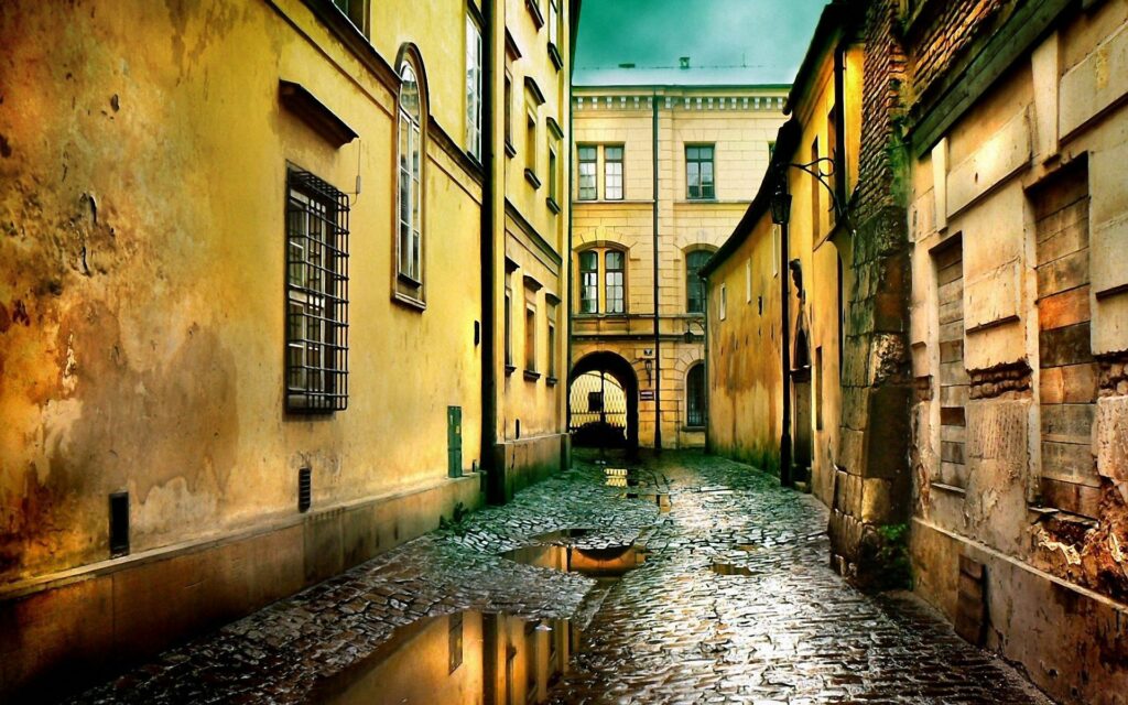 Serene Historic Street Wallpaper - Cobblestone Puddles & Warm Hues