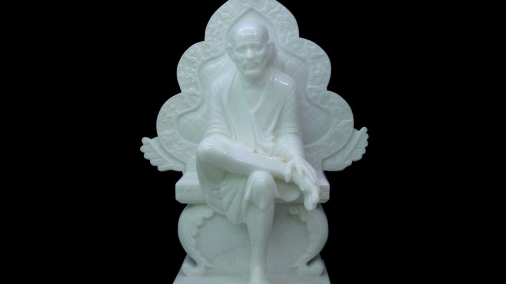 Serenity in Darkness: Sai Baba's Resplendent Minimalist Form on the Throne Wallpaper