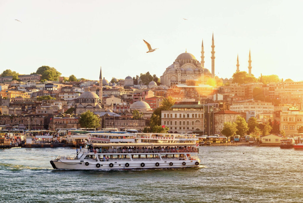Serene Istanbul Sunset: Bosphorus Ferry & Historic Architecture Wallpaper