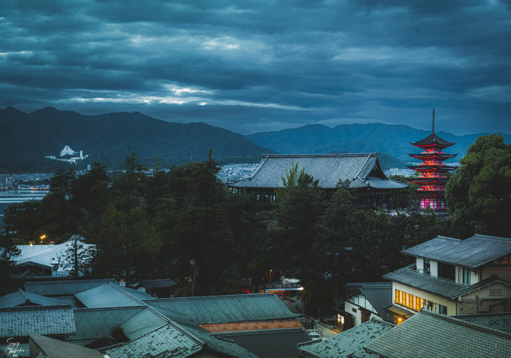Serene Japanese Twilight Landscape Wallpaper with Pagodas & Mountains