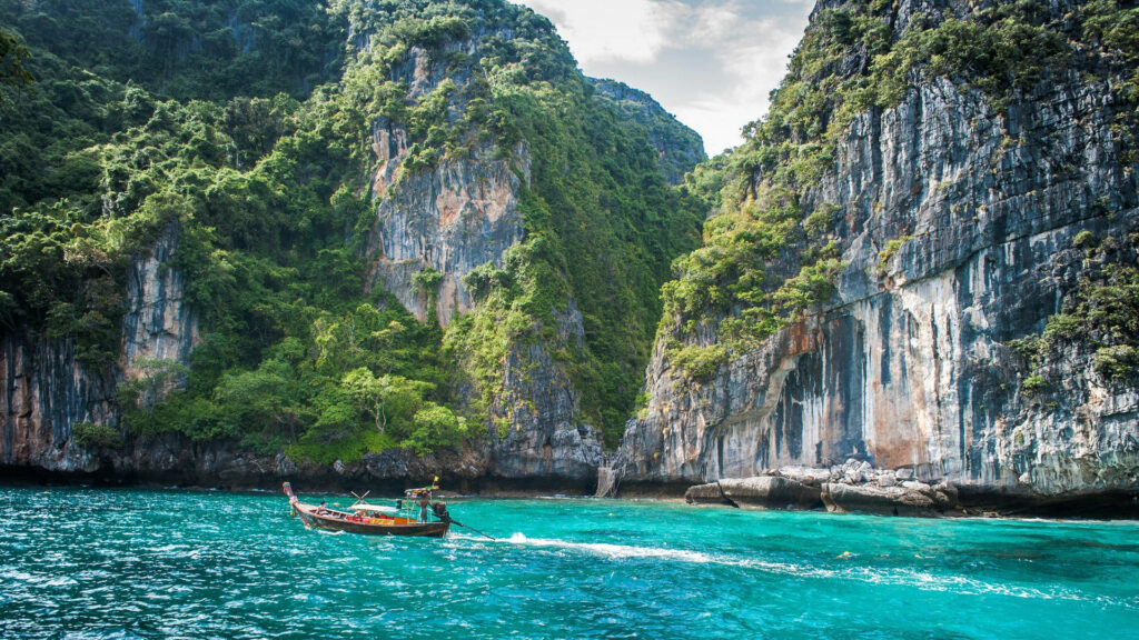 Kayaker on Turquoise Lake: Serene Nature Wallpaper Background