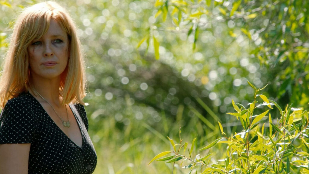 Serene Yellowstone Wallpaper: Kelly Reilly in Sunlit Nature