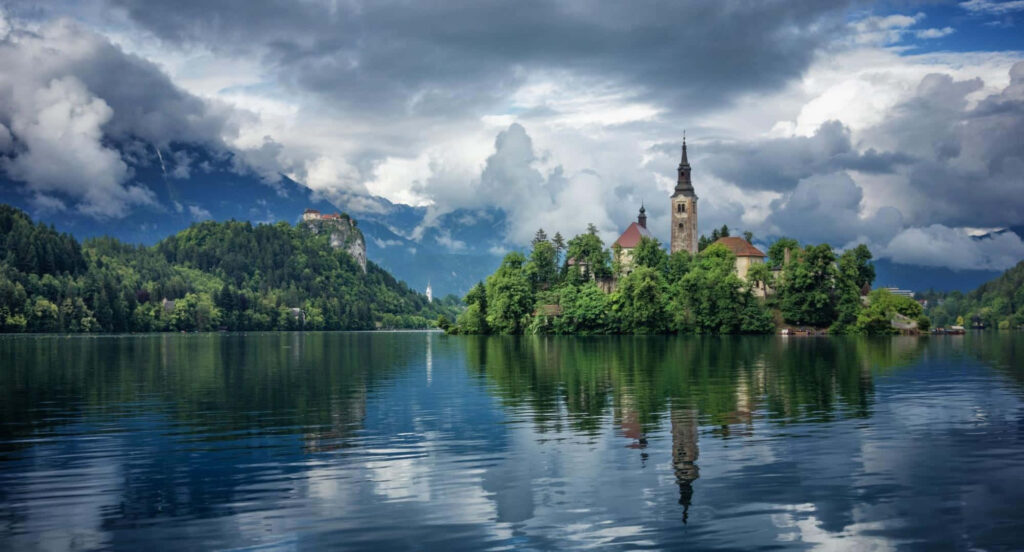 Lake Bled Wallpaper: Serene Island Church & Lush Greenery Reflection