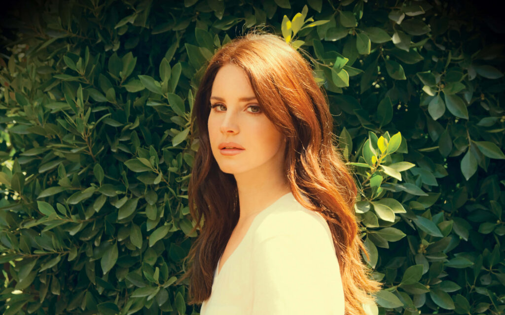 Tranquil Lana Del Rey Wallpaper with Lush Greenery Background