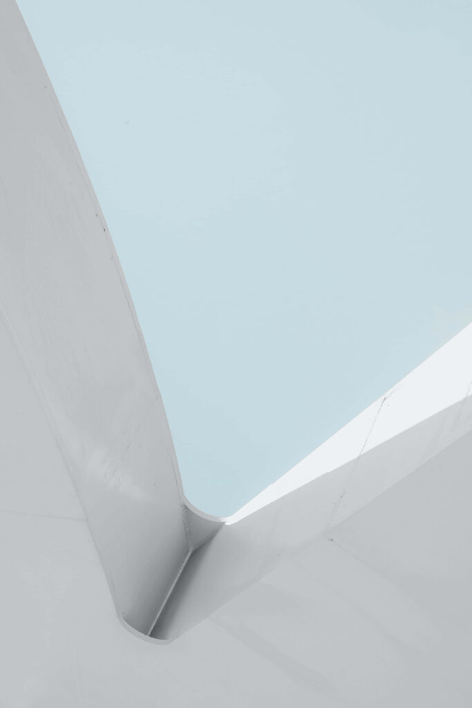 Tranquil Light Blue Sky Minimalist Wallpaper with Modern Architecture