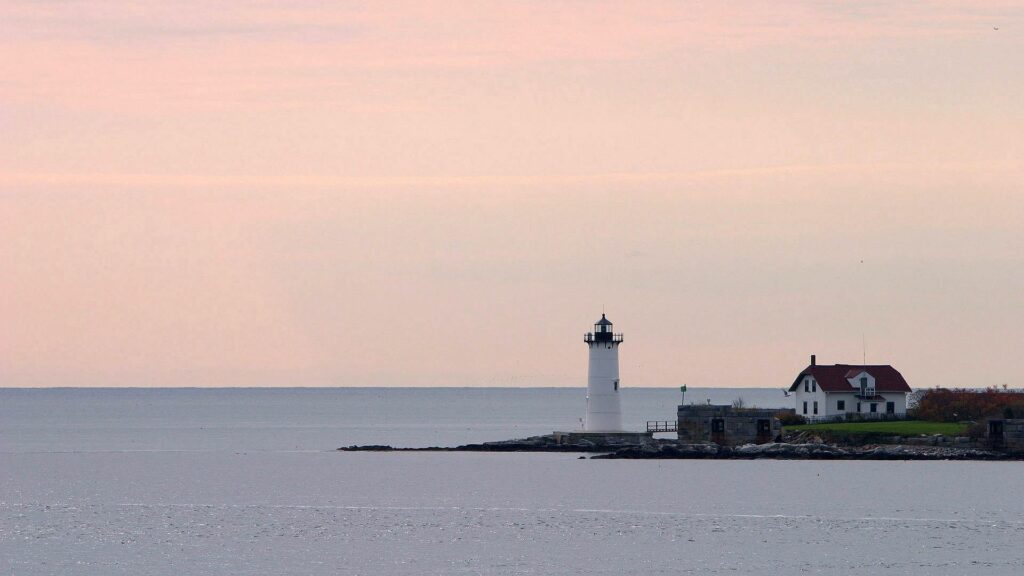 Tranquil Island Lighthouse Wallpaper - Serene Sea & Sky Background