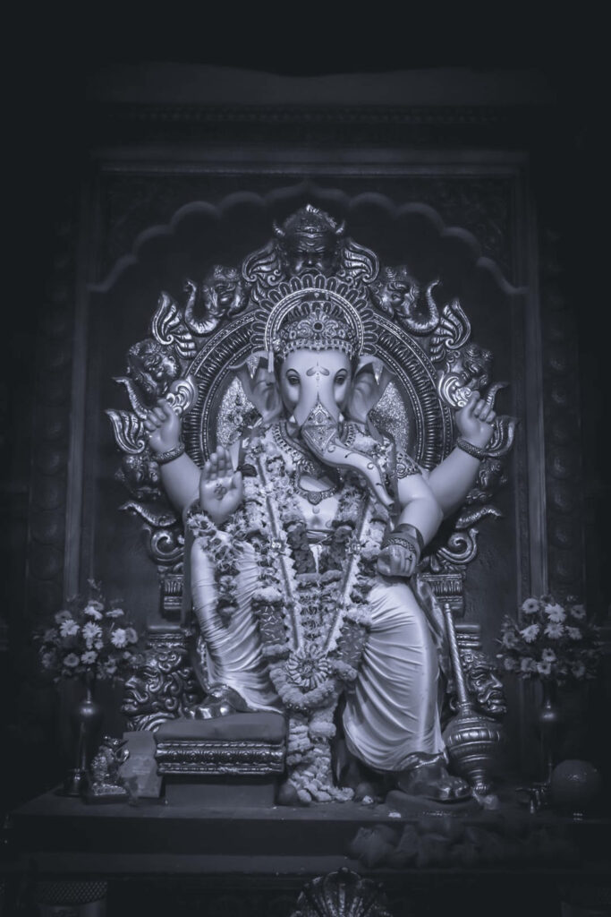 Serene Black and White Lord Ganesh Wallpaper with Temple Backdrop