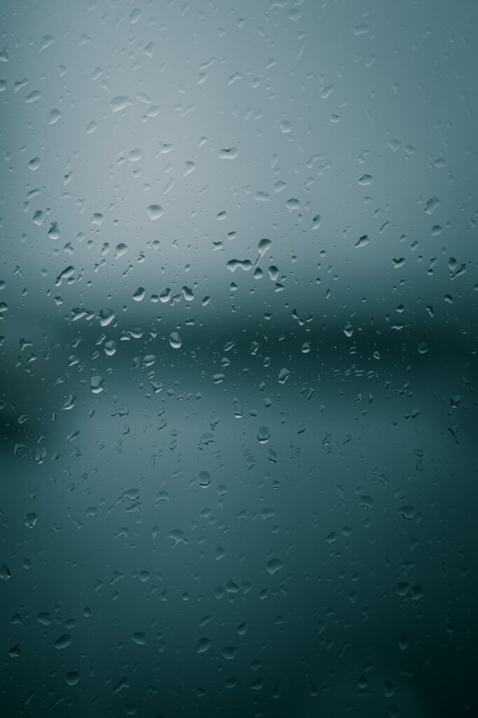 Serene Macro Raindrops on Glass - Soothing Wallpaper Background