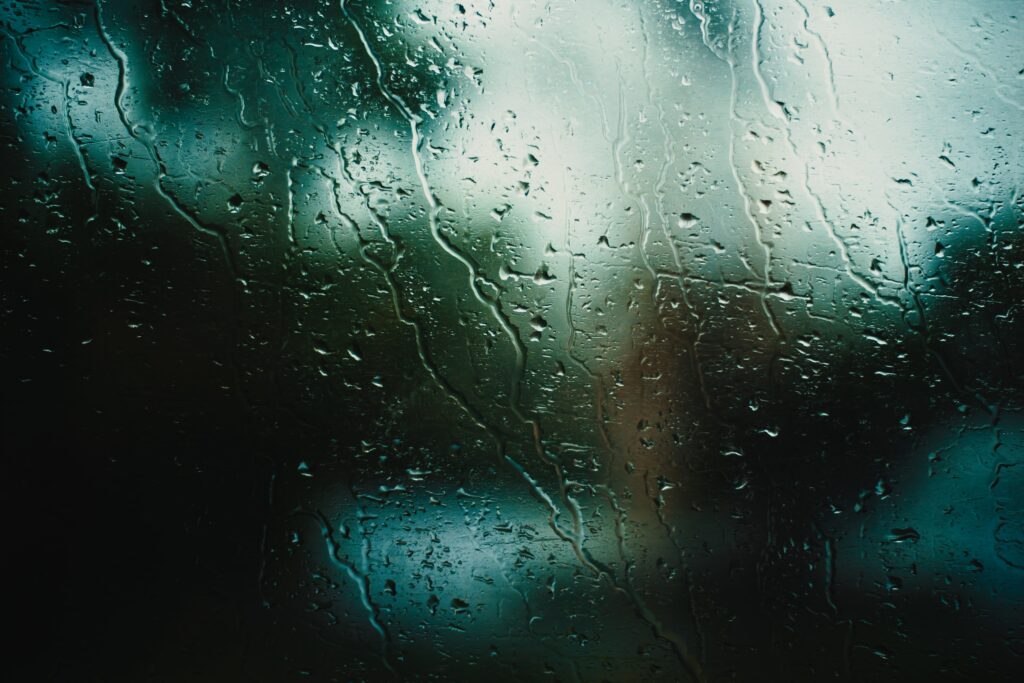 Serene Rain Droplets Wallpaper: Calming Macro Glass Background