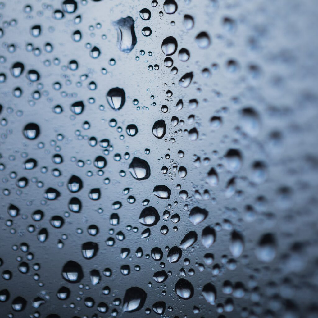 Serene Macro Wallpaper: Water Drops on Smooth Surface Background