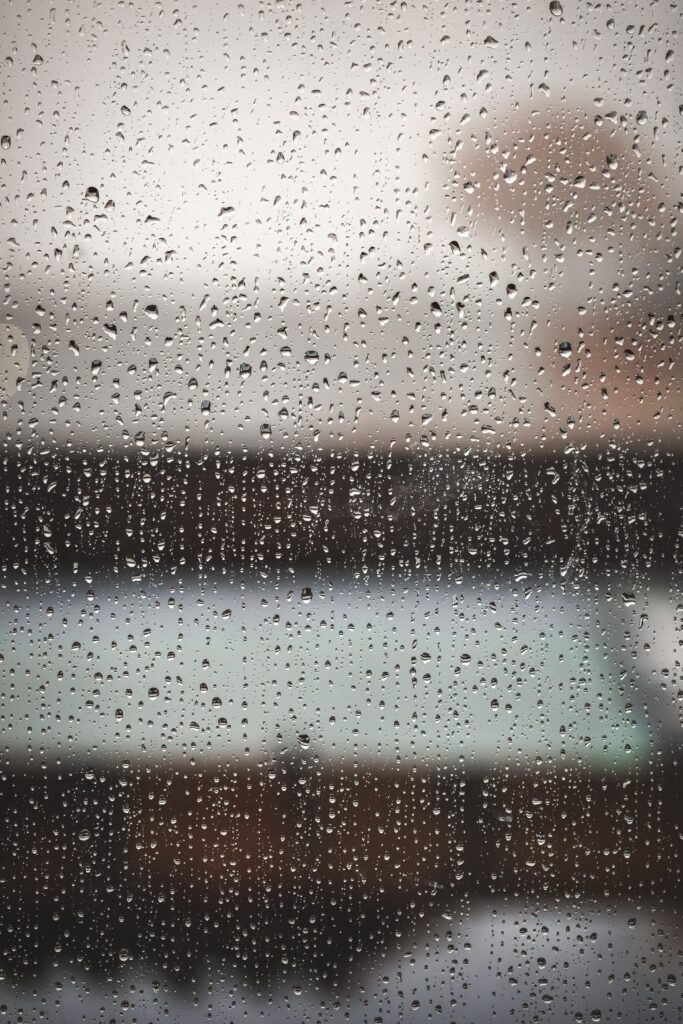 Serene Macro Water Drops Wallpaper Background on Glass Surface