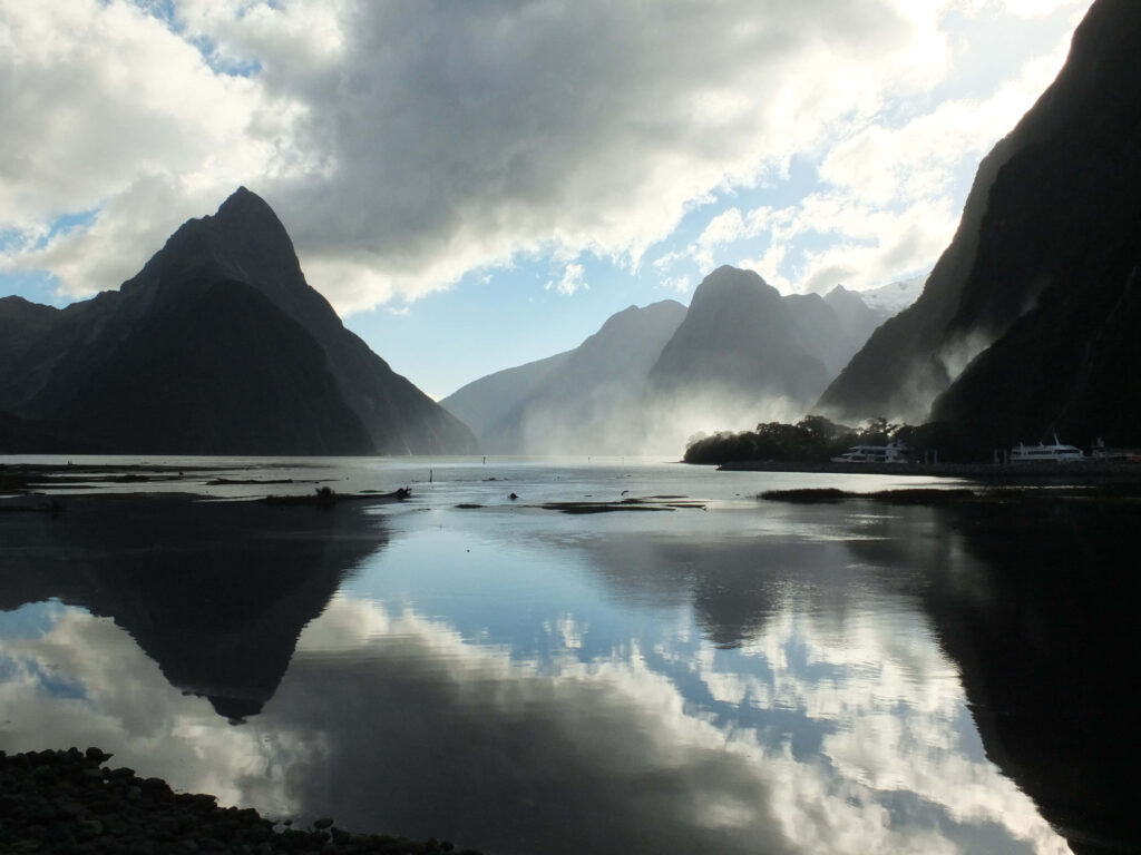 Serene Milford Sound Wallpaper: Towering Rocks & Reflective Waters