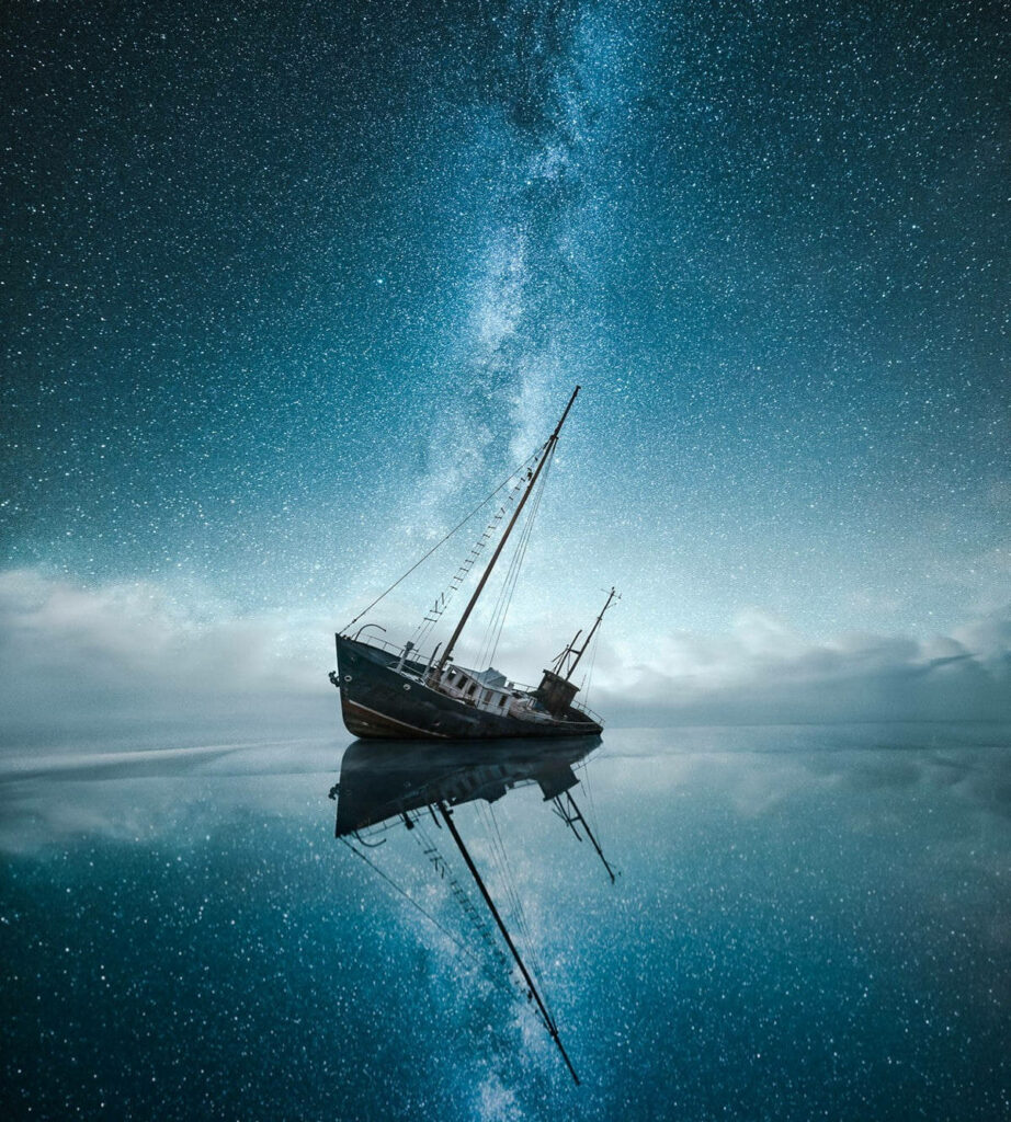 Serene Milky Way Wallpaper: Celestial Beauty Reflected on Calm Sea
