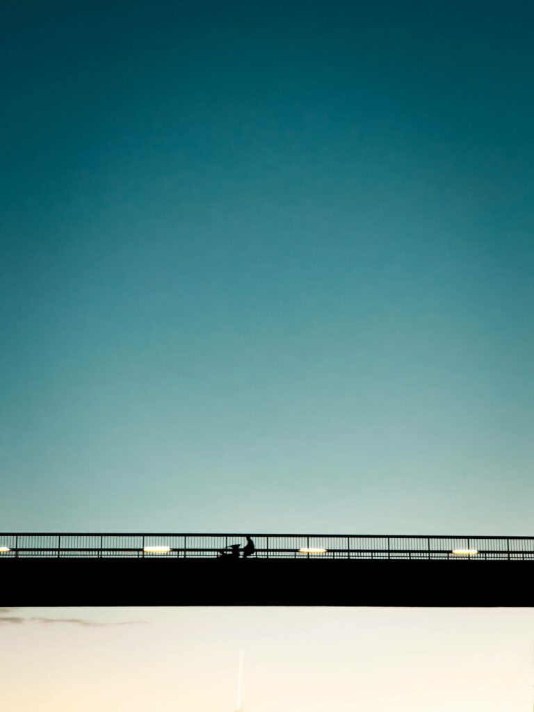 Serene Minimalist Landscape Wallpaper with Bridge Silhouette