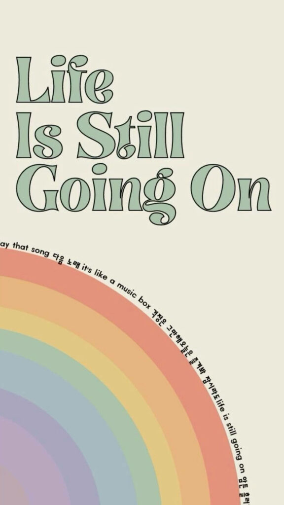 Elegant Minimalist Wallpaper: 'Life Is Still Going On' with Pastel Rainbow