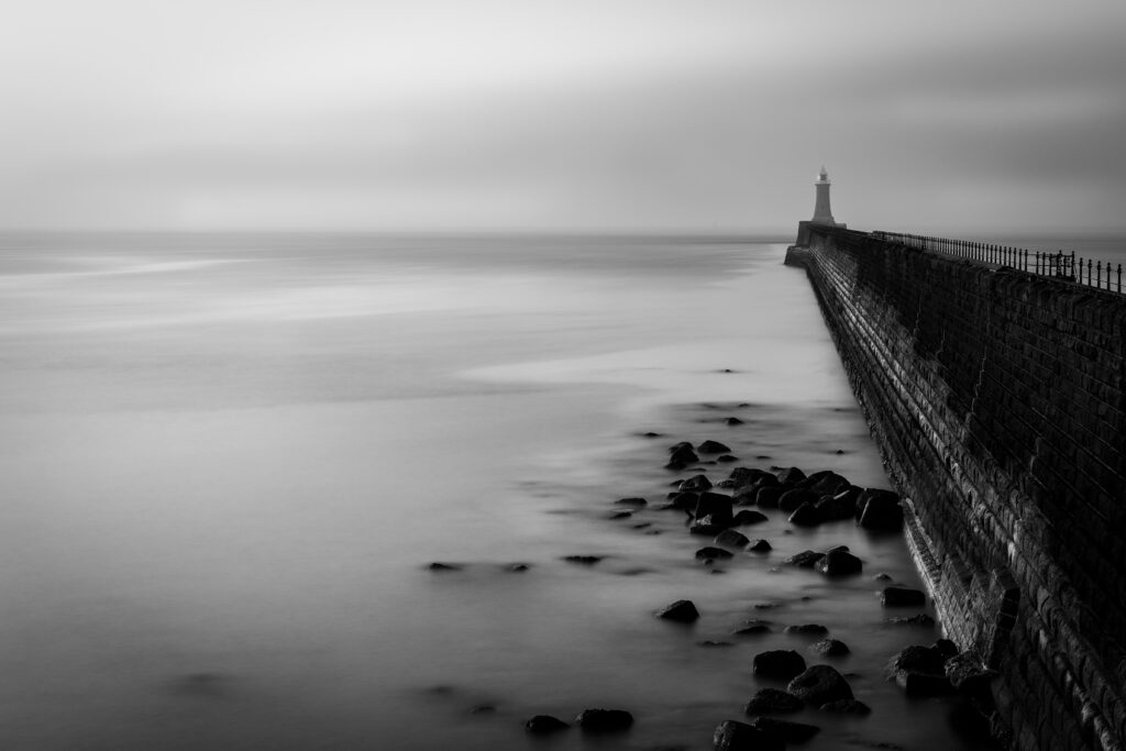 Serene Black-and-White Lighthouse Wallpaper for Calm Background