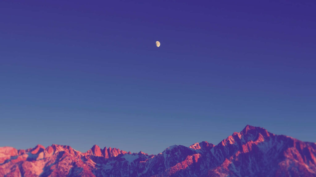 Serene Minimalist Sky Wallpaper with Bright Moon & Sunlit Mountains