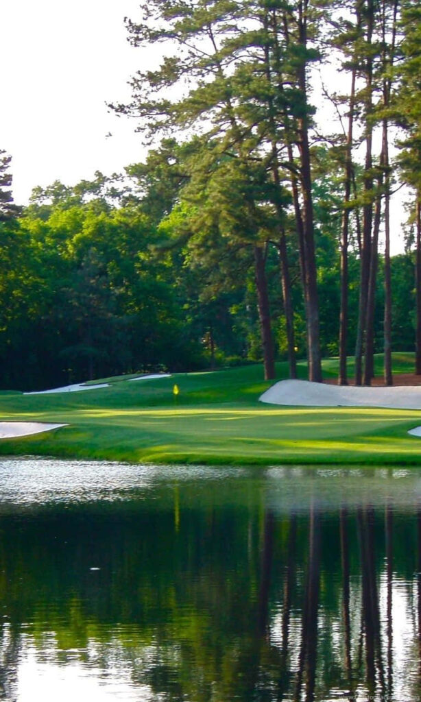 Serene Morning at Augusta National: A Mesmerizing Sunrise Over a Stunning Golfing Haven Wallpaper