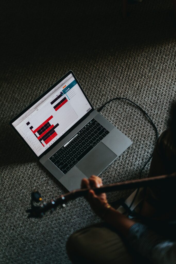 Serene Guitar Practice Wallpaper: Cozy Setup with Music Editing