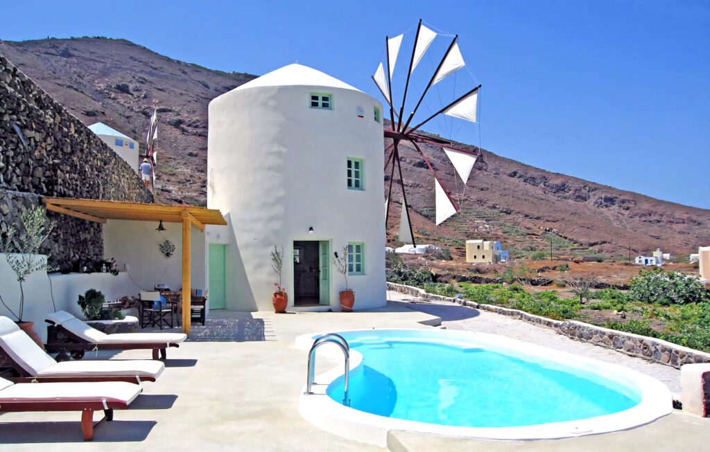 Mykonos Windmills at Sunset: Serene Wallpaper Background